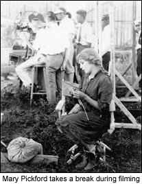Mary Pickford takes a break during filming